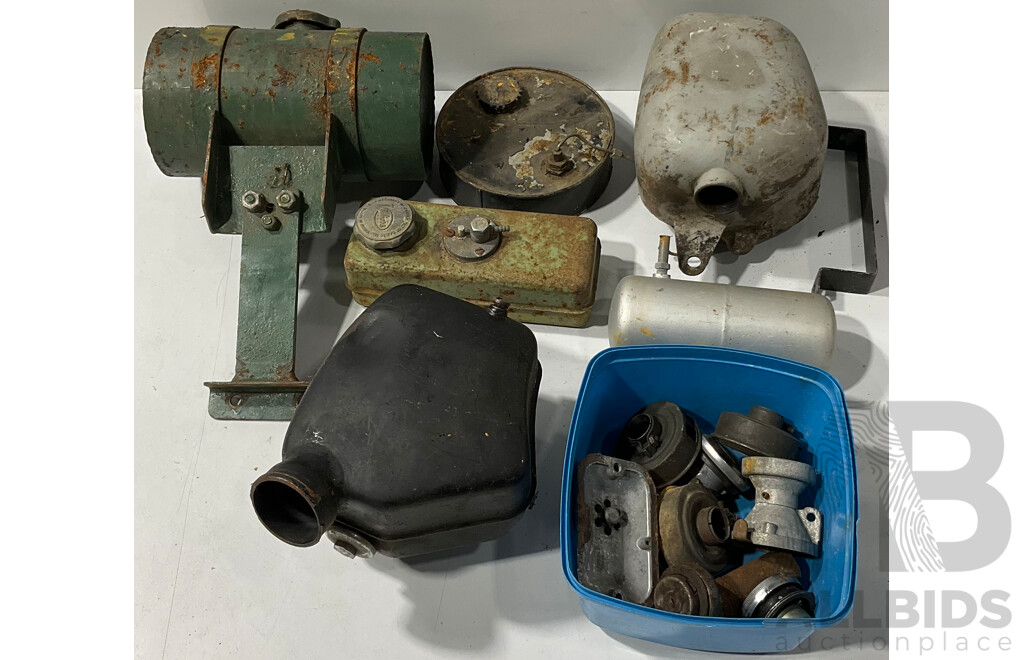 Collection of Vintage Lawn Mower Fuel Tanks and Other Accessories