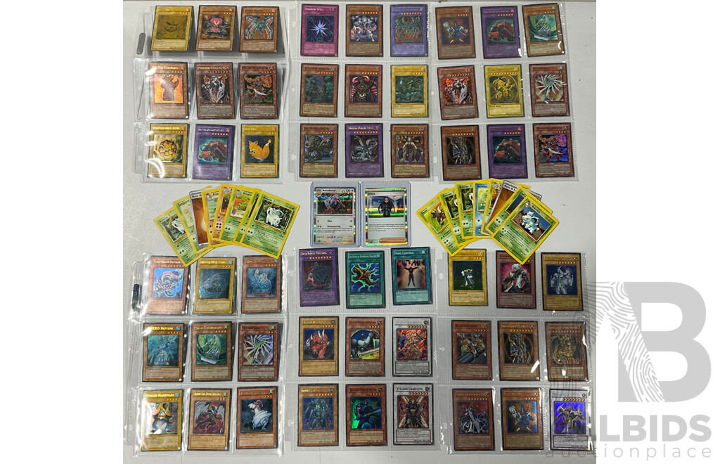 Collection of Pokémon TCG Cards and Yu-Gi-Oh Singles in Binder Pages