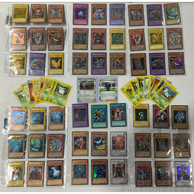 Collection of Pokémon TCG Cards and Yu-Gi-Oh Singles in Binder Pages