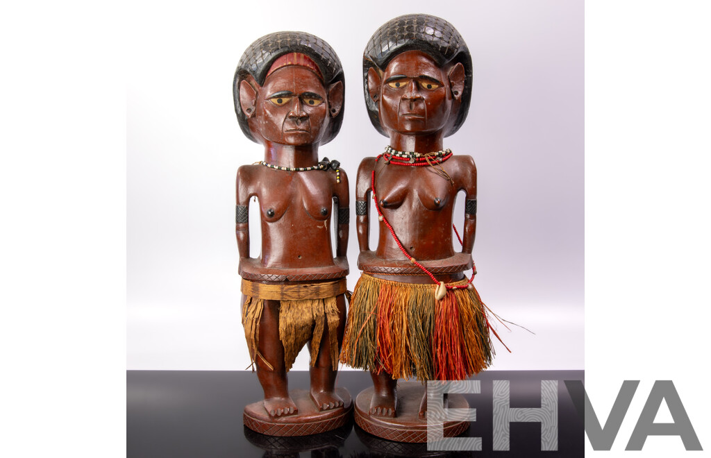 Vintage Pair Carved Hard Wood Melanesian Male and Female Figures with Grass Skirt Detail