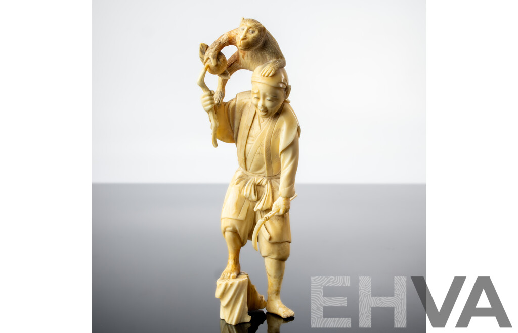 Antique Japanese Hand Carved Ivory Okimono of Man with Sickle and Monkey