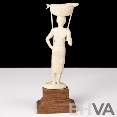 Antique Japanese Hand Carved Ivory Okimono of Fisherman with Fish in Basket, on Wooden Stand