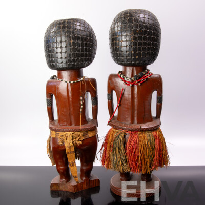 Vintage Pair Carved Hard Wood Melanesian Male and Female Figures with Grass Skirt Detail