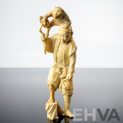 Antique Japanese Hand Carved Ivory Okimono of Man with Sickle and Monkey