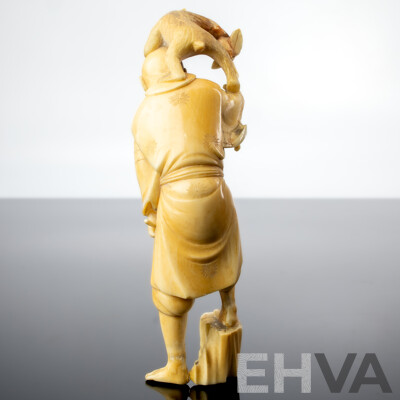 Antique Japanese Hand Carved Ivory Okimono of Man with Sickle and Monkey