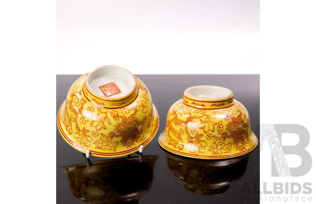 Pair Antique Chinese Porcelain Bowls with Yellow Ground and Dragon Motif, Apocryphal Qianlong Character Marks to Base