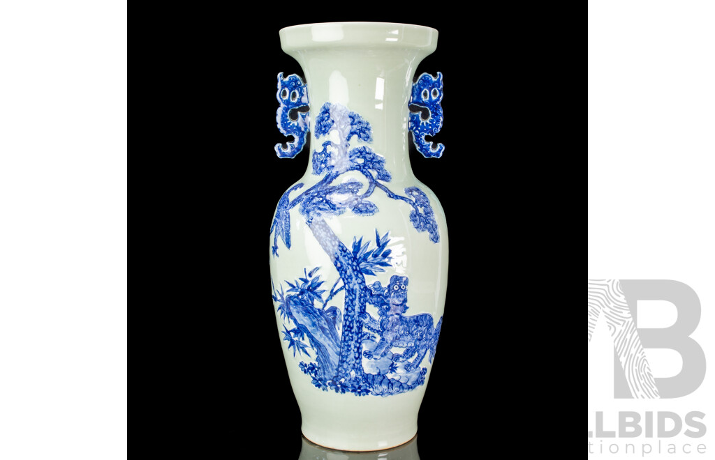 Large Vintage Chinese Porcelain Vase with Twin Lion Dog Form Handles and Body with Raised Blue and White Lion Dog and Eagle Scene with Auspicious Bats to Reverse Side