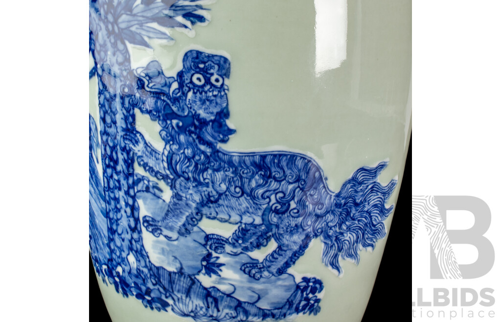 Large Vintage Chinese Porcelain Vase with Twin Lion Dog Form Handles and Body with Raised Blue and White Lion Dog and Eagle Scene with Auspicious Bats to Reverse Side