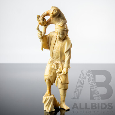 Antique Japanese Hand Carved Ivory Okimono of Man with Sickle and Monkey