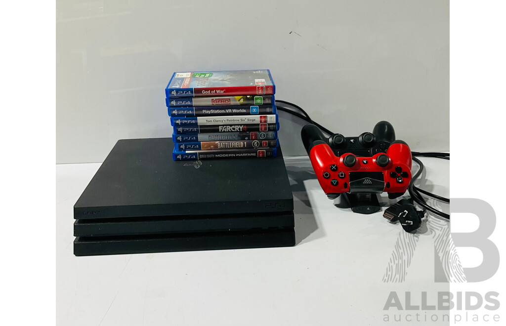 PlayStation 4 Pro Console with Two PS4 DualShock 4 Wireless Controller and Charging Stand as Well as Collection of PS4 Games Including God of War