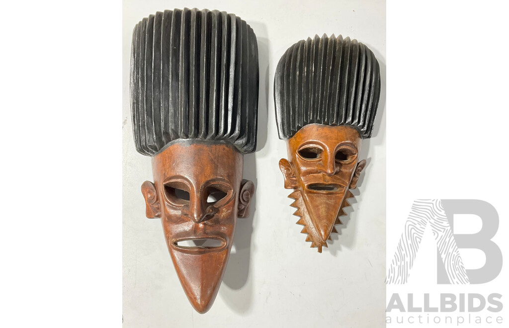 Two Carved Wooden Melanesian Display Masks