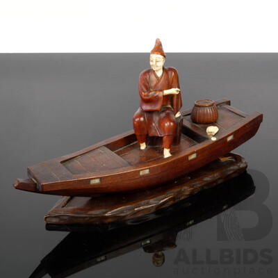 Antique Japanese Hand Carved Wooden Fisherman on Flatboat with Ivory Detail