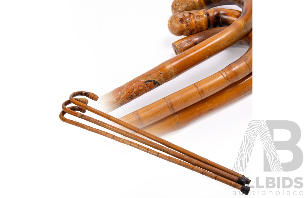 Collection Thee Hand Carved Asian Bamboo Walking Sticks Including Example with Demon Motif Detail