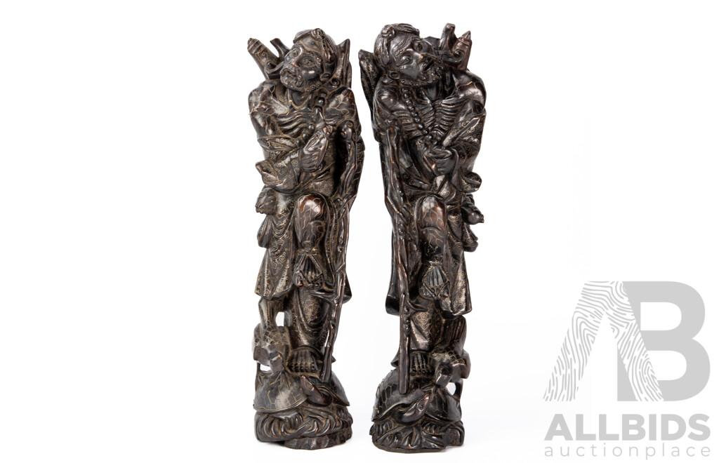 Pair Carved Chinese Hardwood Immortal Figures with Intricate Brass Inlay