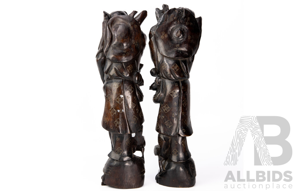 Pair Carved Chinese Hardwood Immortal Figures with Intricate Brass Inlay