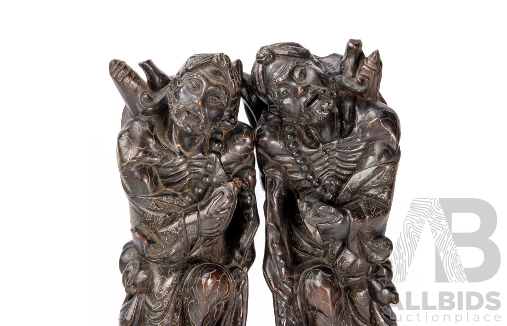 Pair Carved Chinese Hardwood Immortal Figures with Intricate Brass Inlay