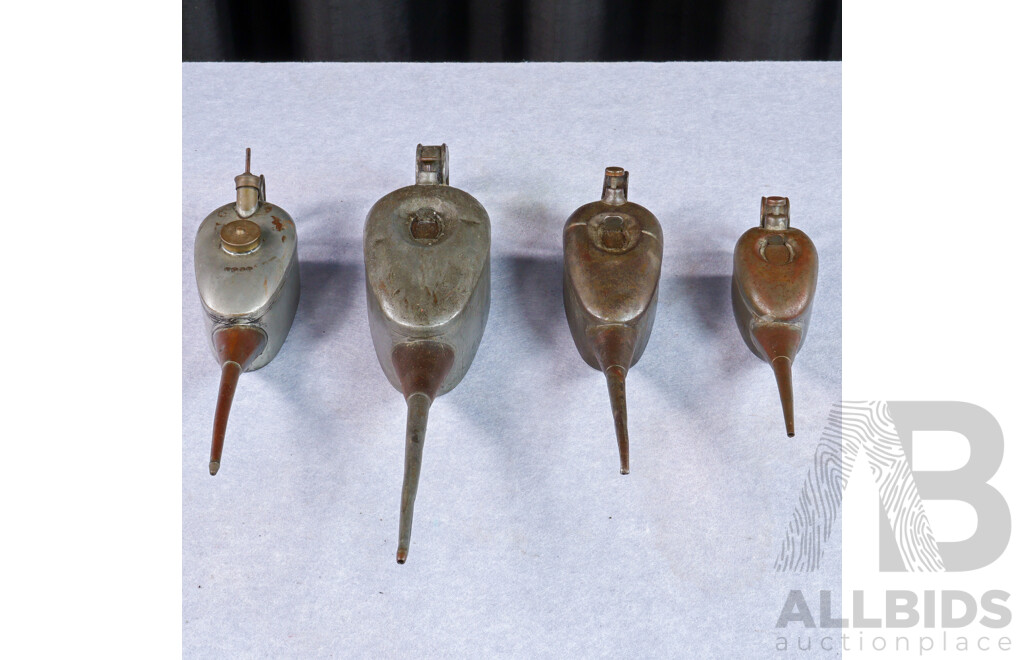 Collection of Four Vintage Metal Graduated Oil Cans
