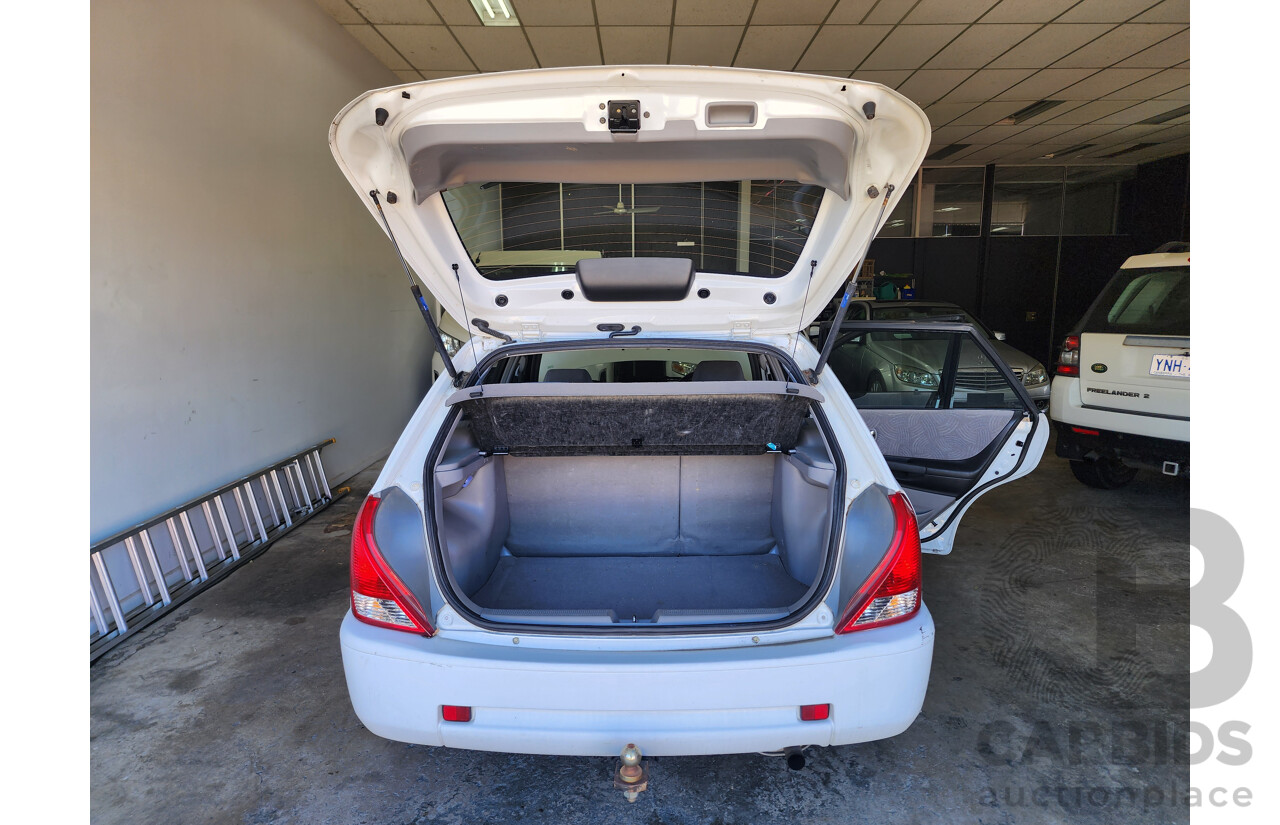 8/2001 Ford Laser LXi KN 5d Hatchback White 1.6L