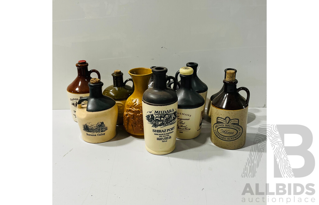 Collection of Ceramic Bottles Including Some with Cork and Other Stoppers