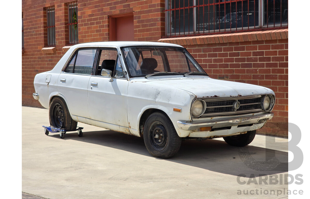 7/1970 Datsun 1200 Standard B110 4d Sedan White 1.2L