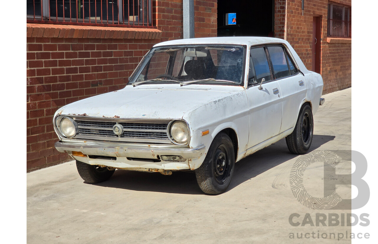 7/1970 Datsun 1200 Standard B110 4d Sedan White 1.2L