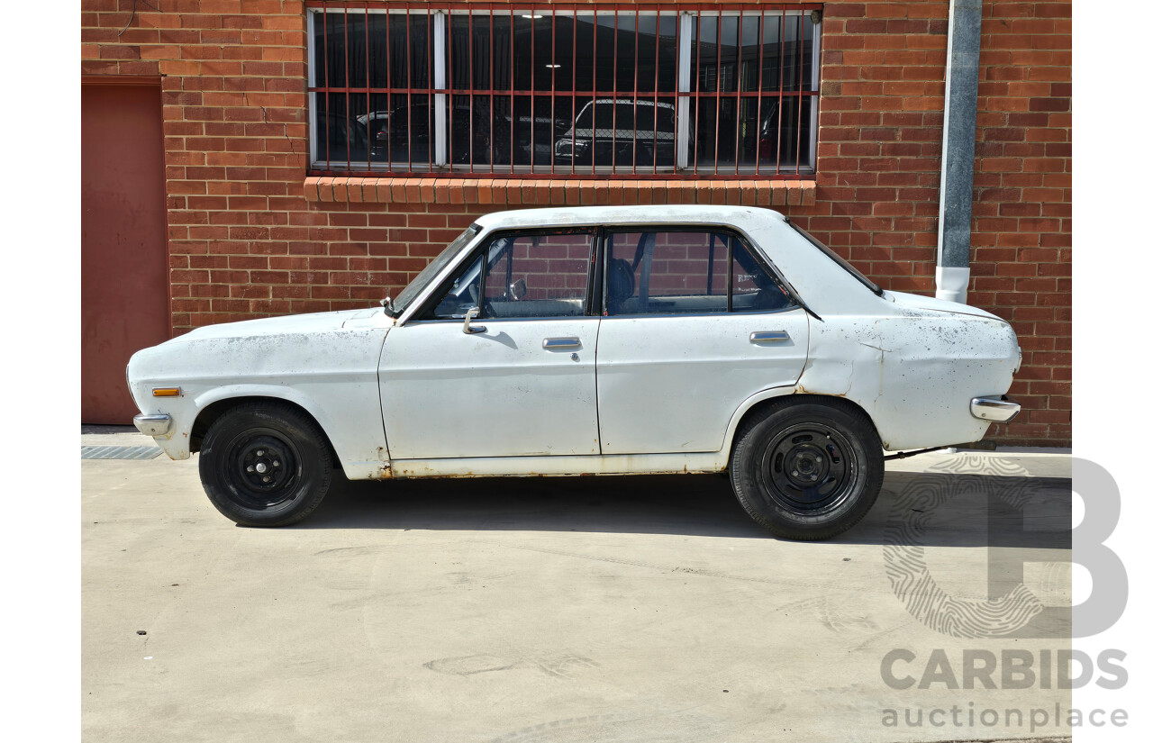 7/1970 Datsun 1200 Standard B110 4d Sedan White 1.2L