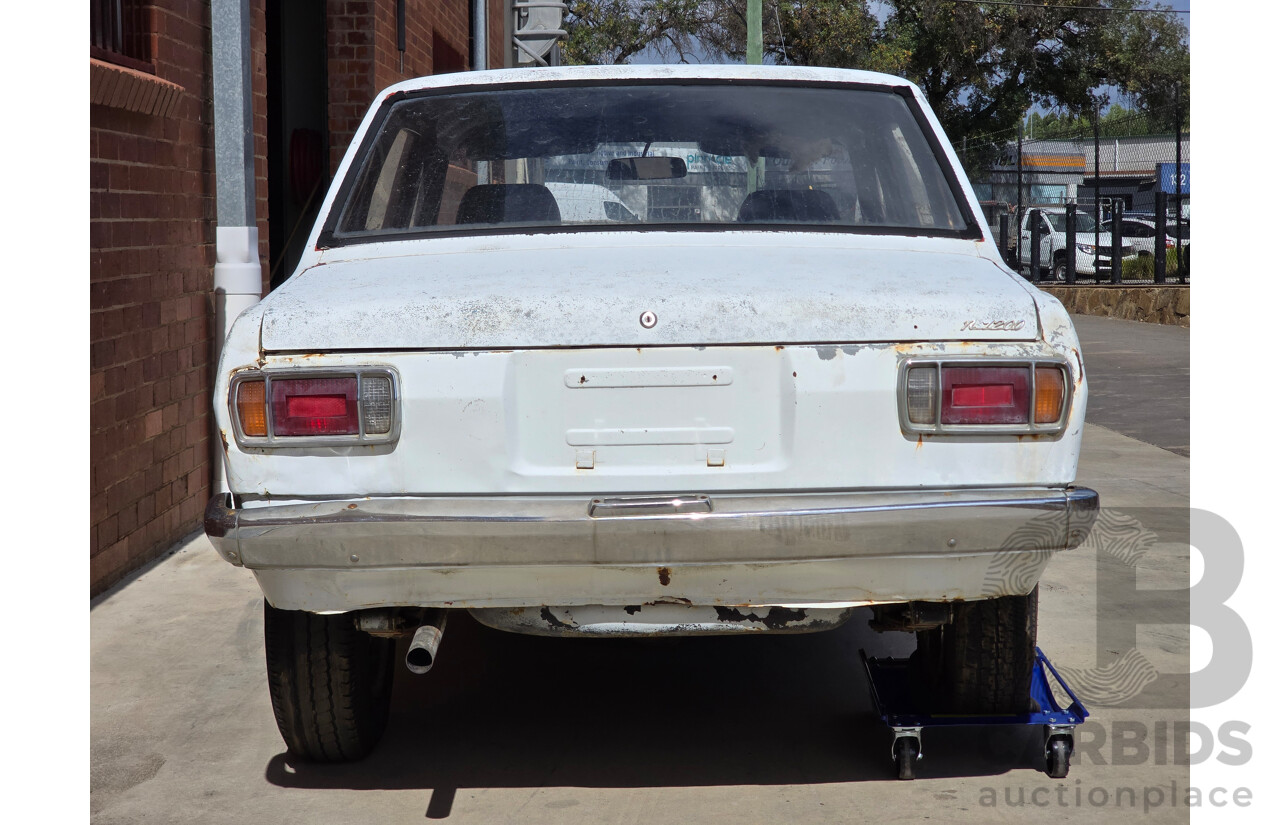 7/1970 Datsun 1200 Standard B110 4d Sedan White 1.2L