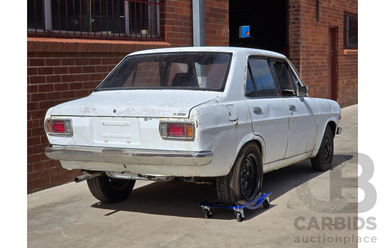 7/1970 Datsun 1200 Standard B110 4d Sedan White 1.2L