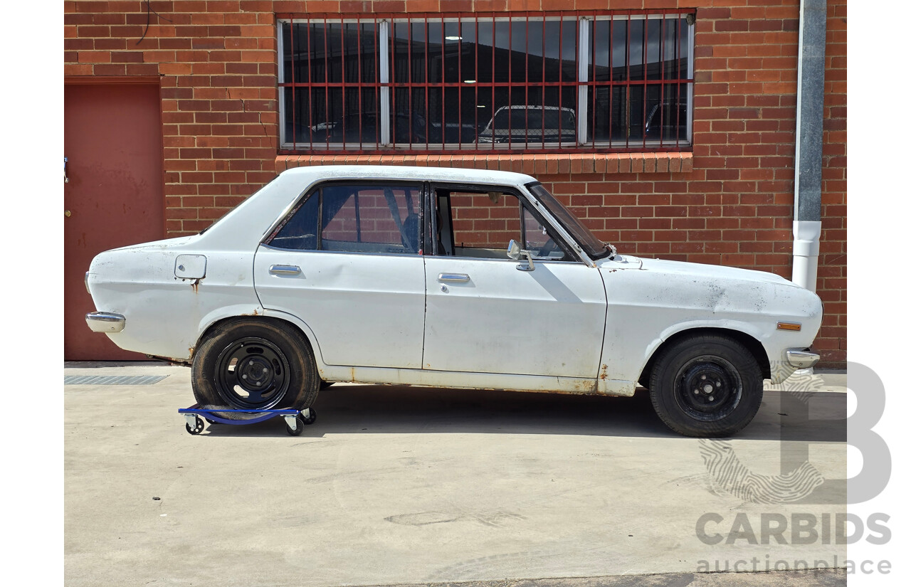 7/1970 Datsun 1200 Standard B110 4d Sedan White 1.2L