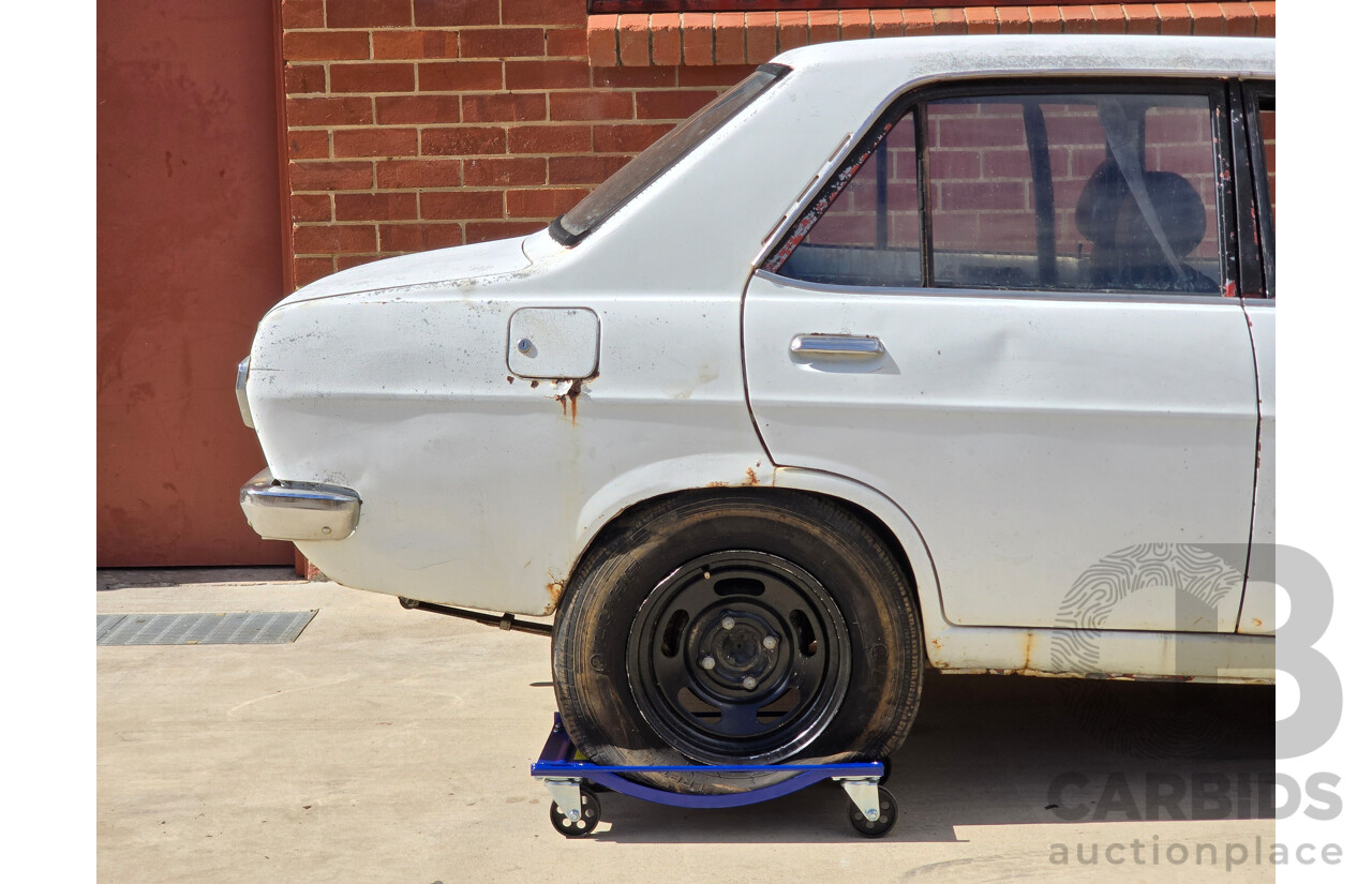 7/1970 Datsun 1200 Standard B110 4d Sedan White 1.2L