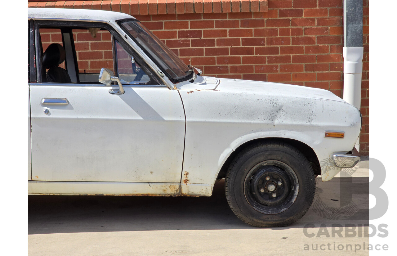 7/1970 Datsun 1200 Standard B110 4d Sedan White 1.2L