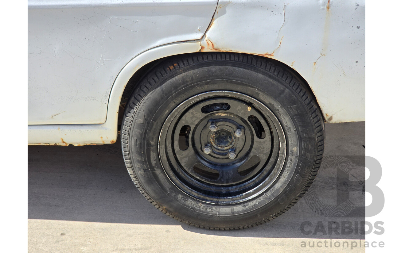 7/1970 Datsun 1200 Standard B110 4d Sedan White 1.2L