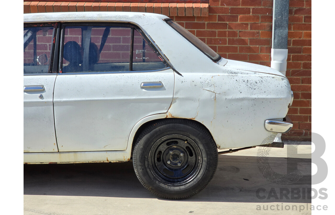 7/1970 Datsun 1200 Standard B110 4d Sedan White 1.2L