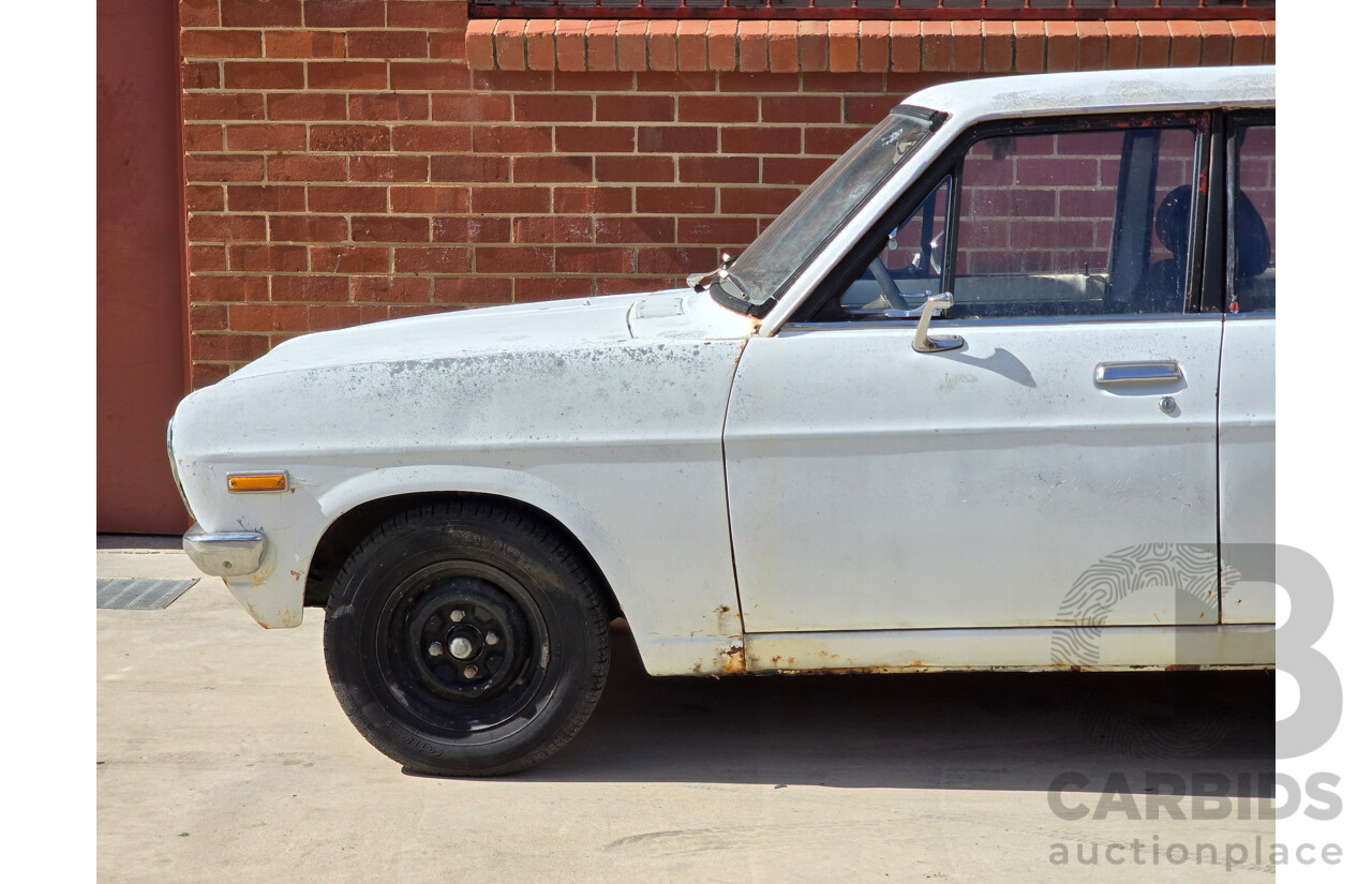 7/1970 Datsun 1200 Standard B110 4d Sedan White 1.2L