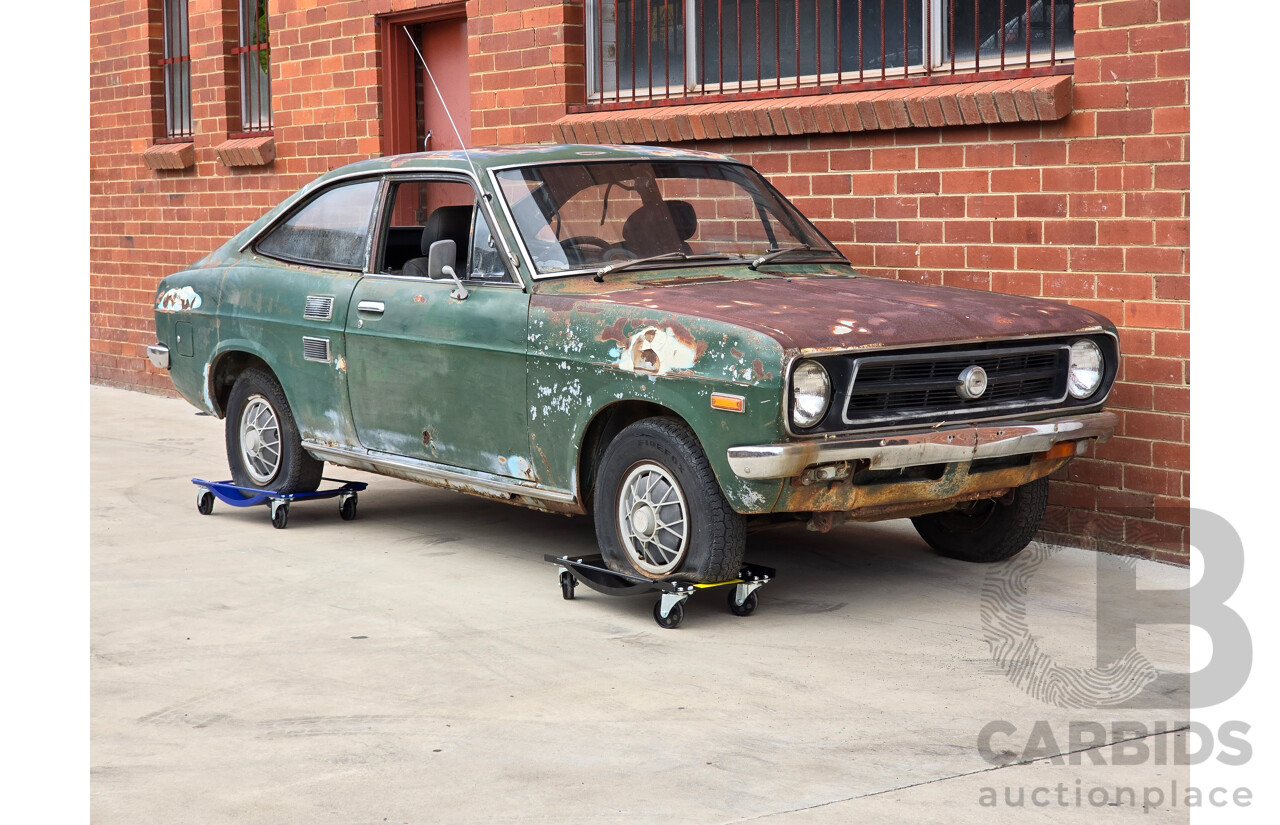 9/1973 Datsun 1200 Deluxe B110 2d Coupe Green 1.2L