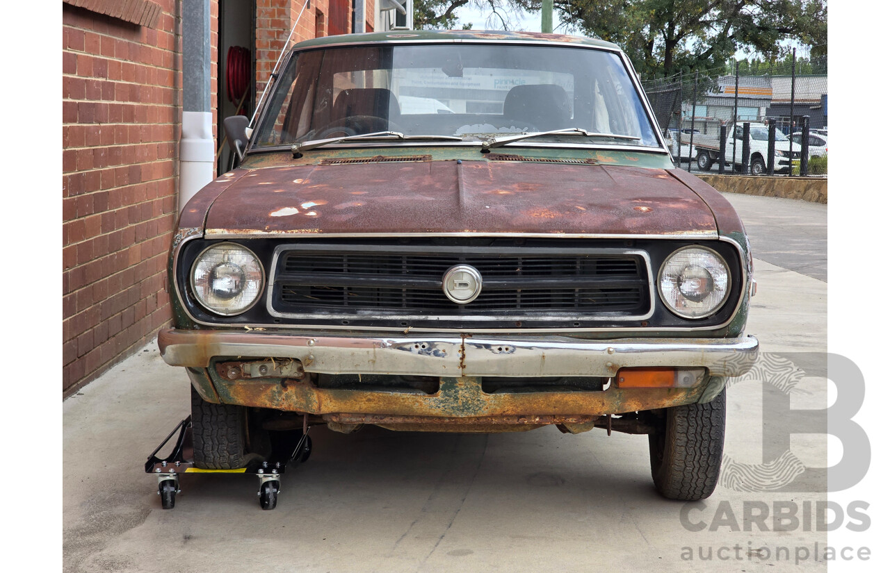 9/1973 Datsun 1200 Deluxe B110 2d Coupe Green 1.2L