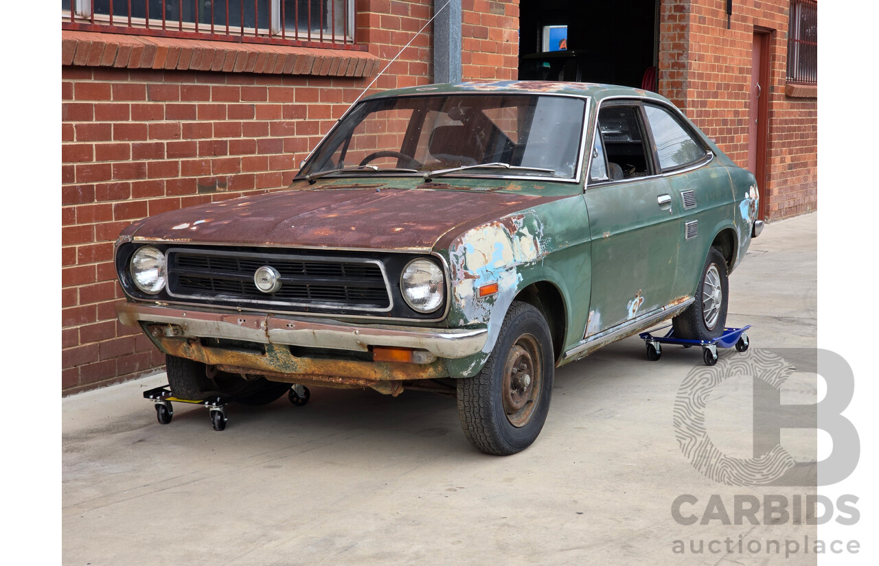 9/1973 Datsun 1200 Deluxe B110 2d Coupe Green 1.2L