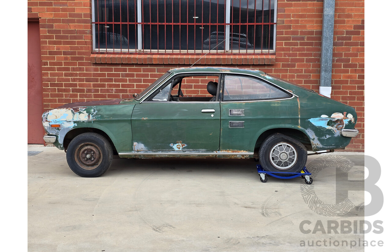 9/1973 Datsun 1200 Deluxe B110 2d Coupe Green 1.2L