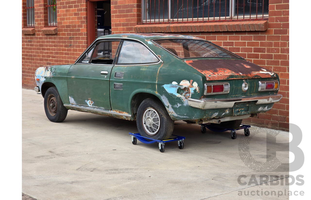 9/1973 Datsun 1200 Deluxe B110 2d Coupe Green 1.2L