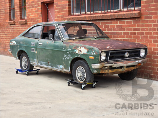 9/1973 Datsun 1200 Deluxe B110 2d Coupe Green 1.2L