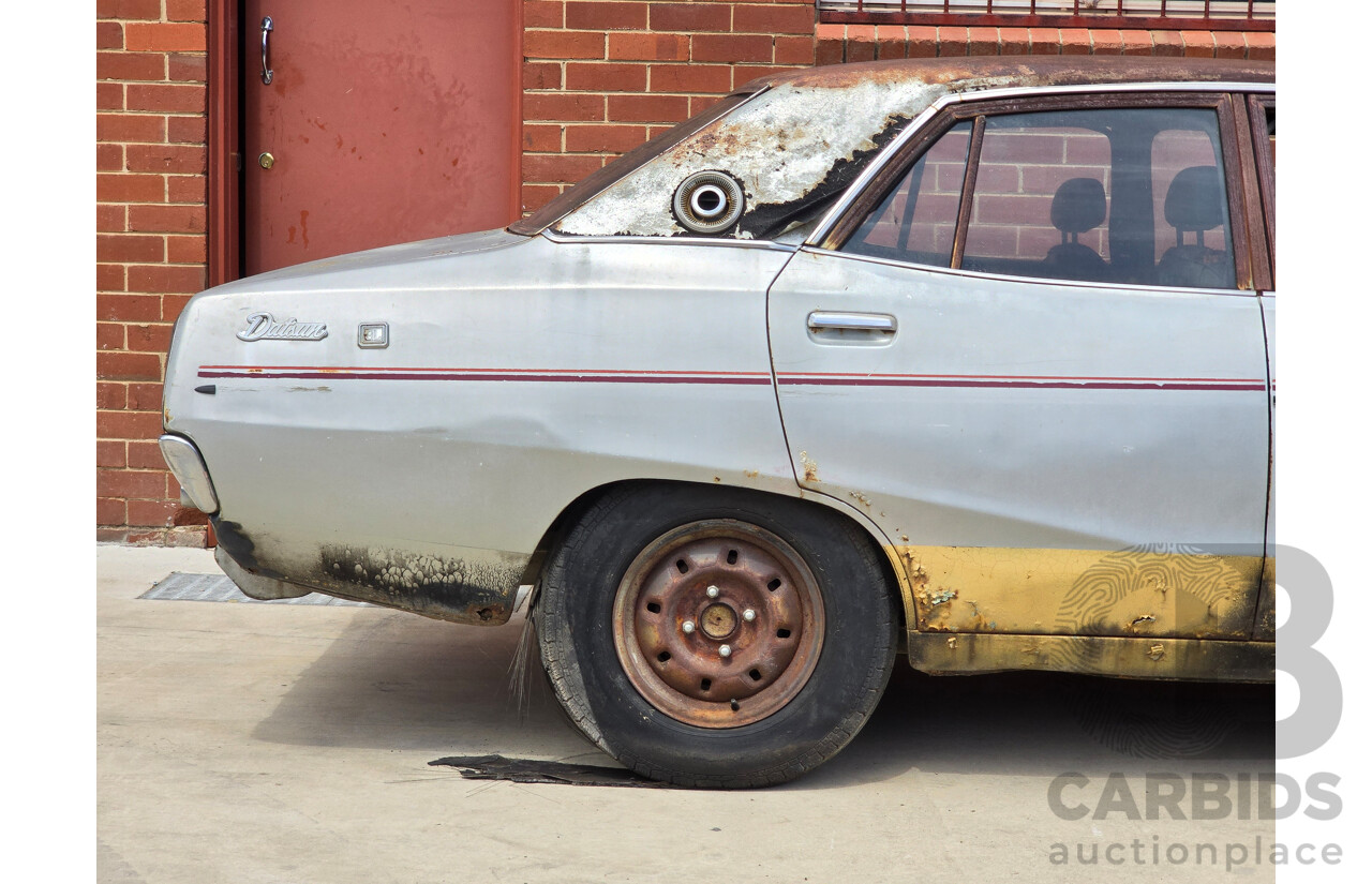 8/1976 Datsun 240k GL HGC110 4d Sedan Black / Silver Metallic 2.4L