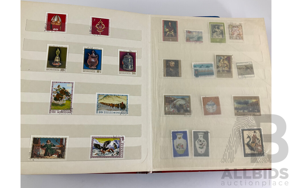 Two Albums of Vintage Stamps Including New Zealand, Dubai, Mongolia, Poland, Cocos Islands, Zimbabwe, Singapore, Canada, Yugoslavia, USA, Netherlands, UK, Fiji, France, PNG, Grenada, Isle of Men