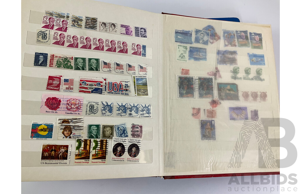 Two Albums of Vintage Stamps Including New Zealand, Dubai, Mongolia, Poland, Cocos Islands, Zimbabwe, Singapore, Canada, Yugoslavia, USA, Netherlands, UK, Fiji, France, PNG, Grenada, Isle of Men
