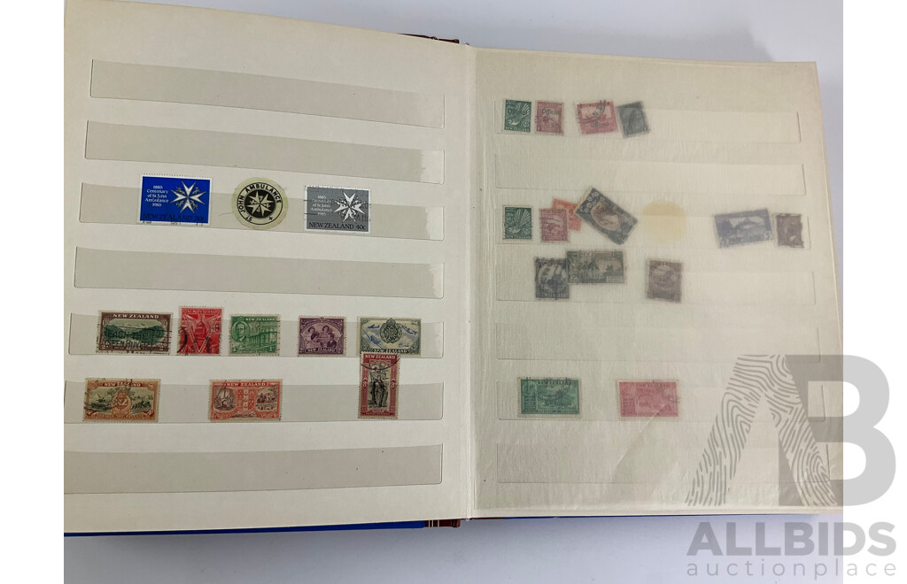 Two Albums of Vintage Stamps Including New Zealand, Dubai, Mongolia, Poland, Cocos Islands, Zimbabwe, Singapore, Canada, Yugoslavia, USA, Netherlands, UK, Fiji, France, PNG, Grenada, Isle of Men