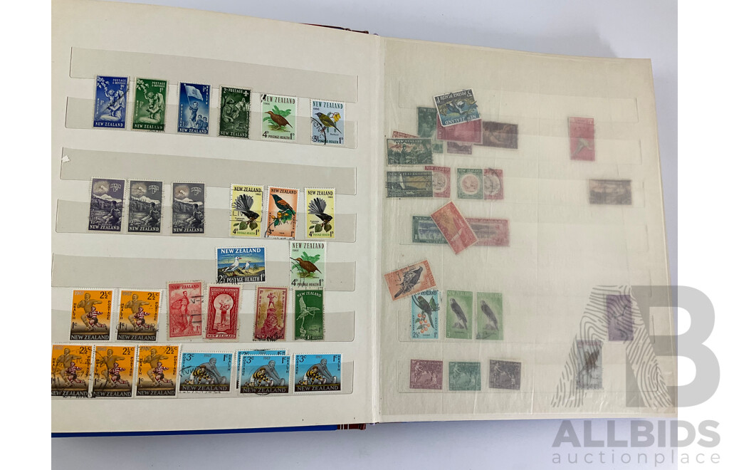 Two Albums of Vintage Stamps Including New Zealand, Dubai, Mongolia, Poland, Cocos Islands, Zimbabwe, Singapore, Canada, Yugoslavia, USA, Netherlands, UK, Fiji, France, PNG, Grenada, Isle of Men