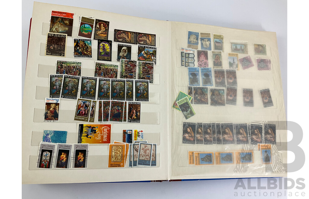 Two Albums of Vintage Stamps Including New Zealand, Dubai, Mongolia, Poland, Cocos Islands, Zimbabwe, Singapore, Canada, Yugoslavia, USA, Netherlands, UK, Fiji, France, PNG, Grenada, Isle of Men