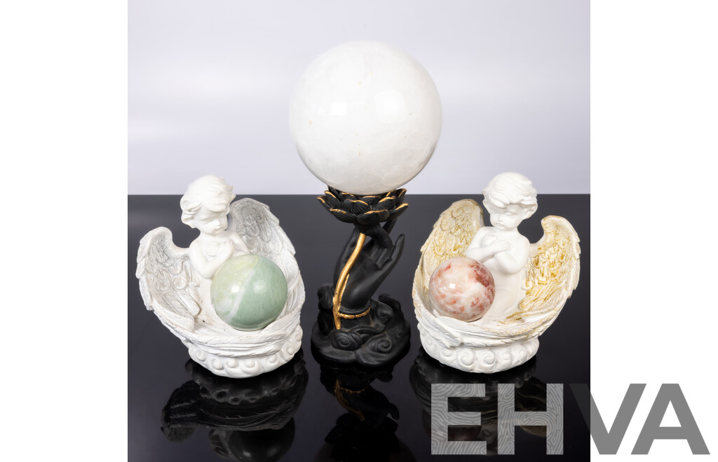 Collection Carved Stone Spheres on Composite Stands Including Pair Angels and Large White Quartz Sphere
