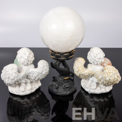 Collection Carved Stone Spheres on Composite Stands Including Pair Angels and Large White Quartz Sphere