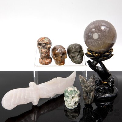Collection Carved Polished Stone Pieces Including Three Memento Mori Skulls Sphere on Composite Stand and More