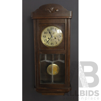 Antique Chiming Wall Clock with Beveled Glass and Carving on Pediment